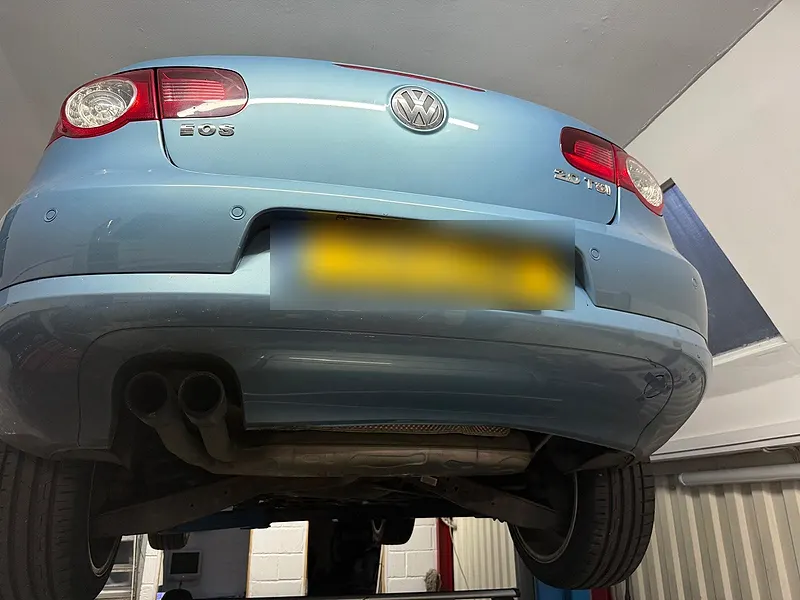 Car raised on a lift for inspection at Raimondi Auto Services Old Woking