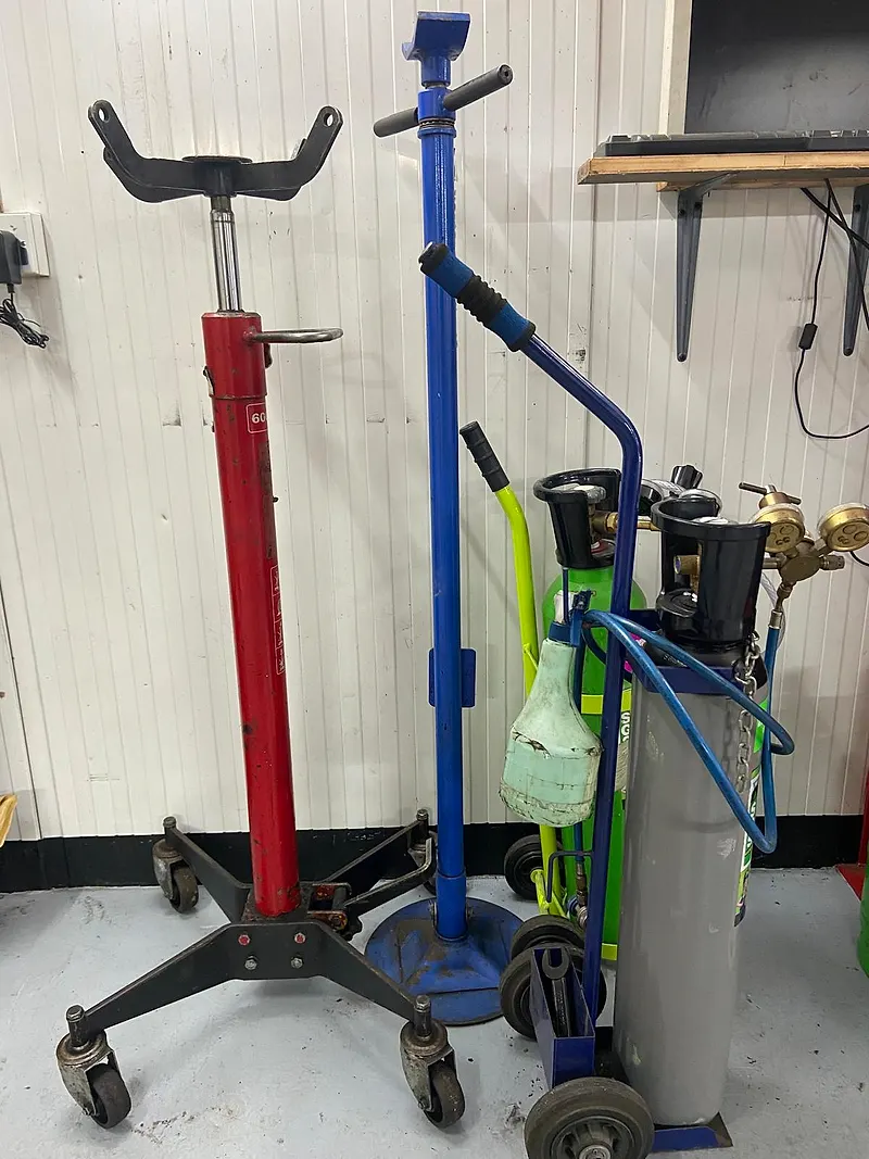 Welding gas bottles and transmission jacks at Raimondi Auto Services Old Woking