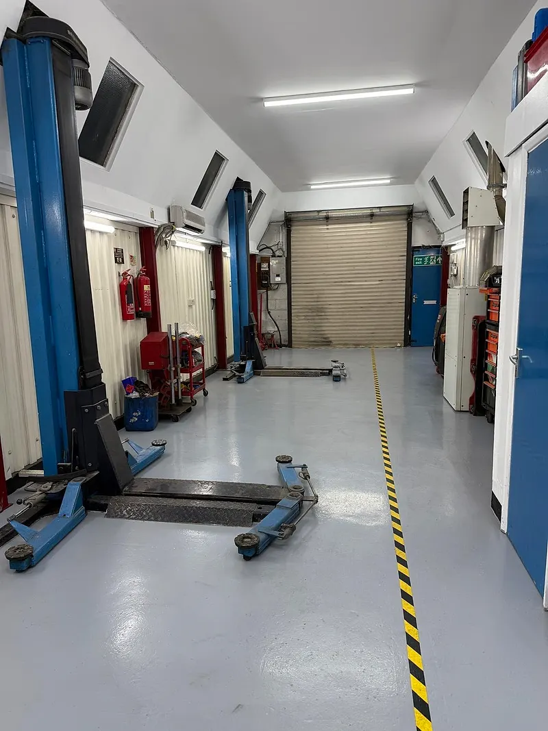 Two-post vehicle lifts in the Raimondi Auto Services workshop Old Woking